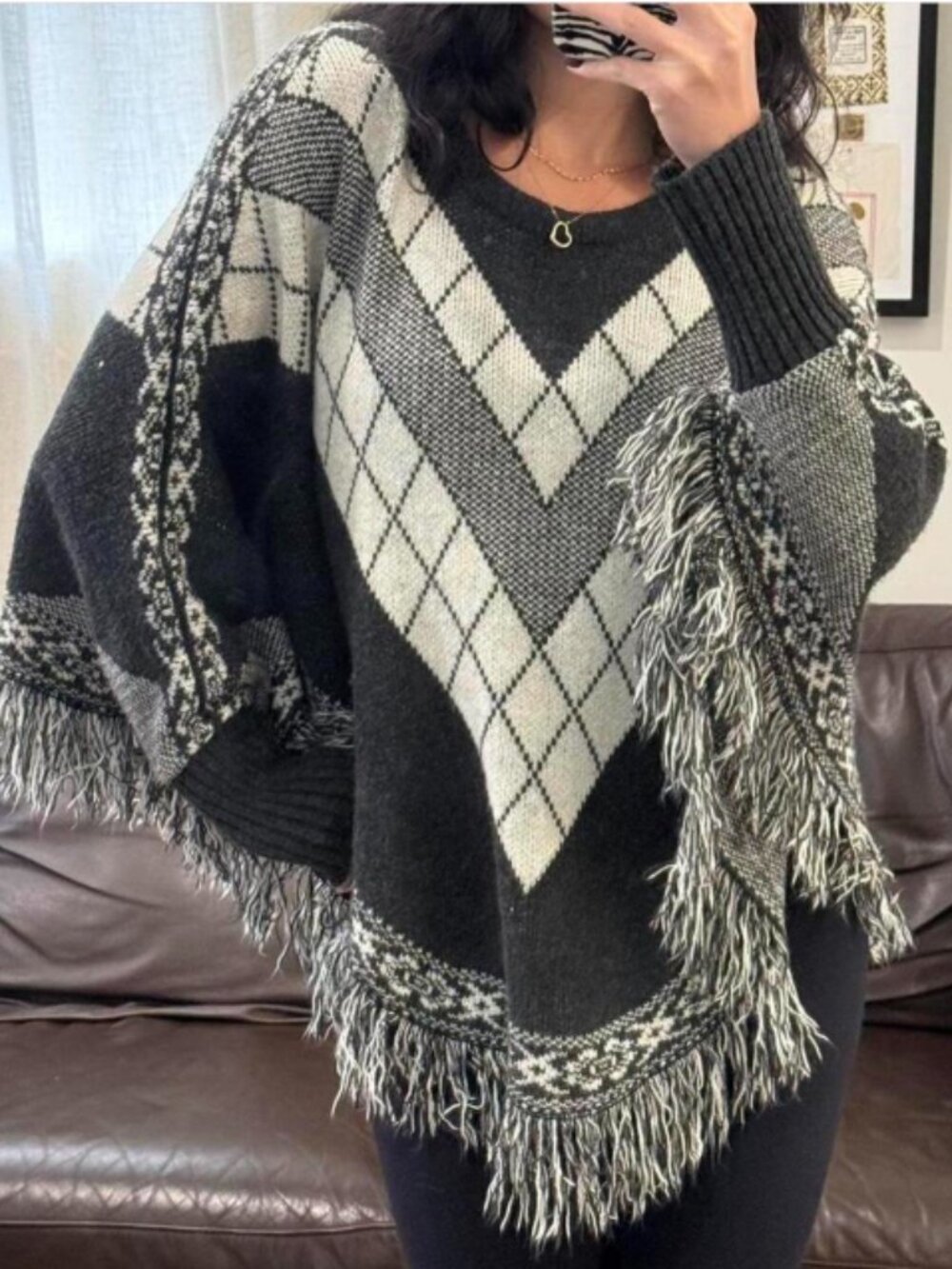 Women's fringed poncho sweater